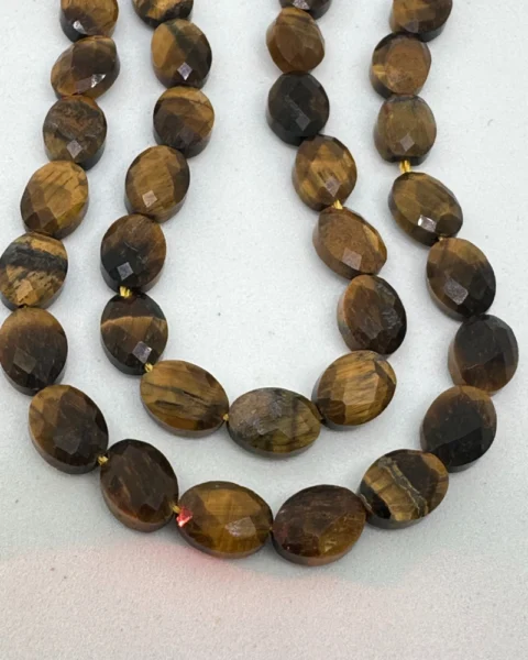 Tigers Eye Faceted Oval Beads Approx 6 x 8mm 38cm Strand